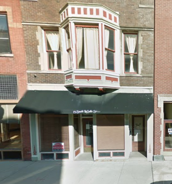 Mayoral candidate Guzman's non-profit was late paying property taxes six times on this storefront property at 73 S. LaSalle Street in Aurora.