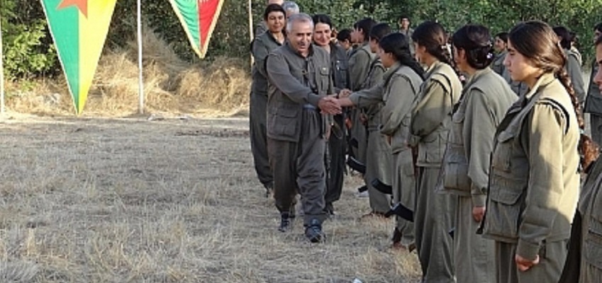 PKK female Guerilla fighters welcome Syrian Kurdish delegation from the YPG at a meeting in Kirkuk Aug. 2