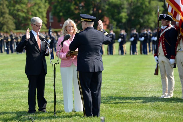Army Secretary John M. McHugh, far left, swears in Army Chief of Staff Gen. Mark A. Milley as the 39th chief of staff of the Army during a ceremony on Summerall Field, Joint Base Myer-Henderson Hall, Va., Aug. 14, 2015. Milley's wife, Hollyanne, holds the