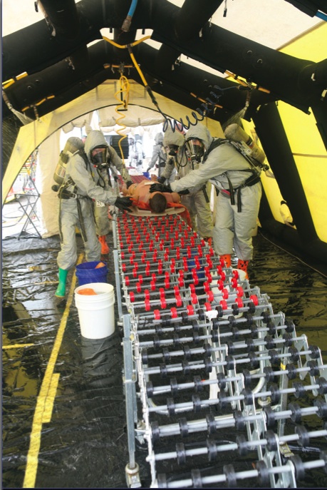 Michigan hospital employees simulate the decontamination of a survivor following a simulated mass-casualty incident during a recent DHS training session.