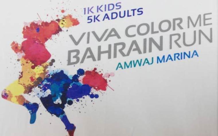 Colored powder kicked up by runners paints participants in the Color Me Bahrain runs.