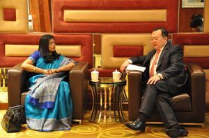 OPCW Deputy Director-General Ambassador Grace Asirwatham, left, and Assistant Minister for Foreign Affairs of China Liu Jianchao