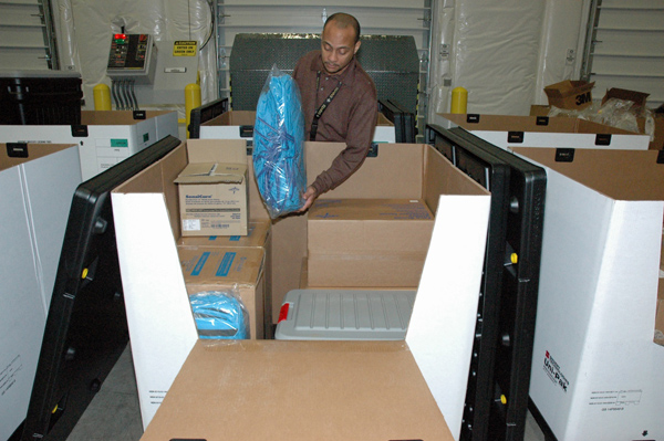 CDC personnel are assembling product from the Strategic National Stockpile into individual personal protective equipment kits, each of which can be used to care for one Ebola patient for up to five days.