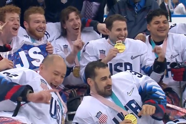 Paralympic team USA sled hockey team shortly after winning gold in South Korea on Monday. Josh Misiewicz is seated in the middle of the the top row.