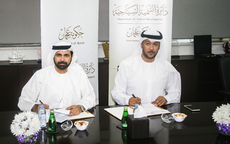 Faisal Al Nuaimi, General Manager of ATDD (right) signs the new cooperative agreement with Ali Issa Al Nuaimi, Director General of Ajman DED.
