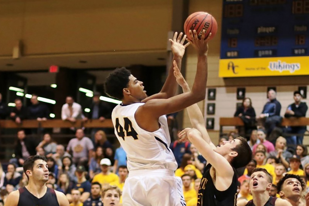 Augustana's Micah Martin puts up a shot over and Illinois Wesleyan defender.