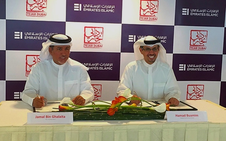 Hamad Buamim (right), Dubai Chamber of Commerce CEO, signs an agreement with Emirates Islamic CEO Jamal Bin Ghalaita.