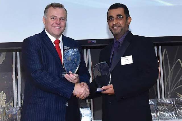 Sami Omar Al Zadjali, right, receives the 2015 Asian Banking and Finance Awards prize for Website of the Year – Oman.