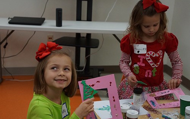 Children from local organization enjoy activities with U of A students.