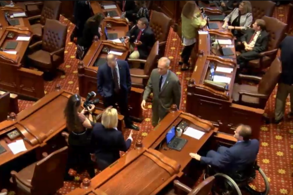 Gov. Bruce Rauner walks on the Senate floor after passage of SB1947.