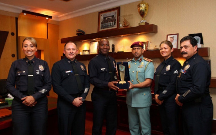 Col. Al Shamesi presents a commemorative shield to the Head of the US delegation.