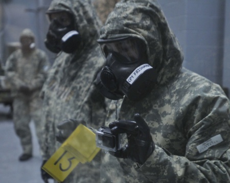 Capt. Maria Frishman helps lead a chemical-threat response drill with paratroopers and a live chemical agent this week at Fort Leonard Wood in Missouri.