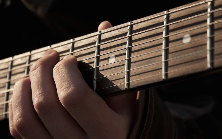Aaron Lavinder studies guitar under Bridgewater College adjunct instructor of music Richard Adams.