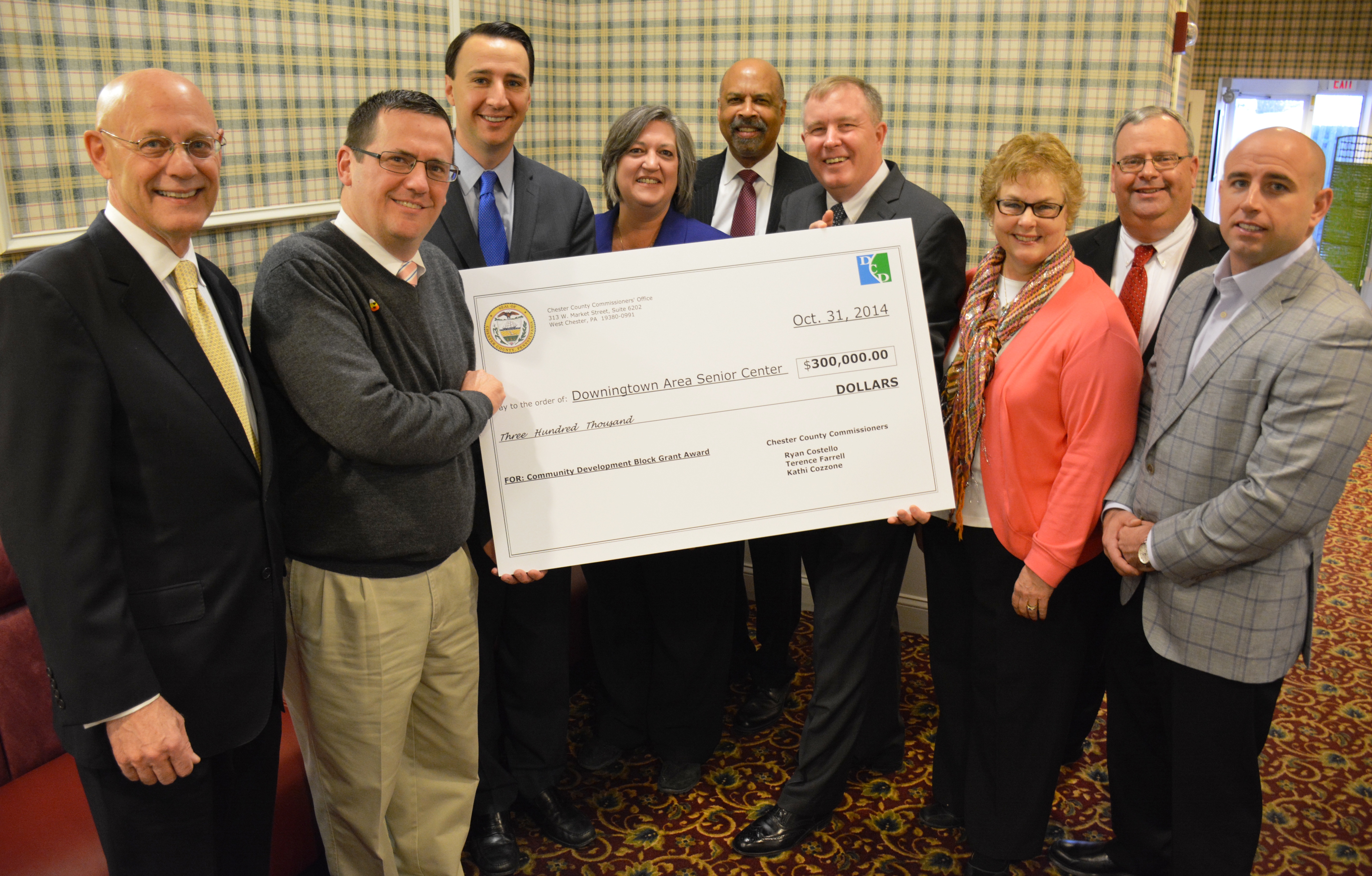 Chester County commissioners present the Downington County Senior Center with a $300,000 check for building upgrades.