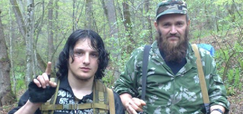 Two foreign fighters training in Bandar, Afghanistan stop to pose for a photograph used by Islamic State for propaganda.